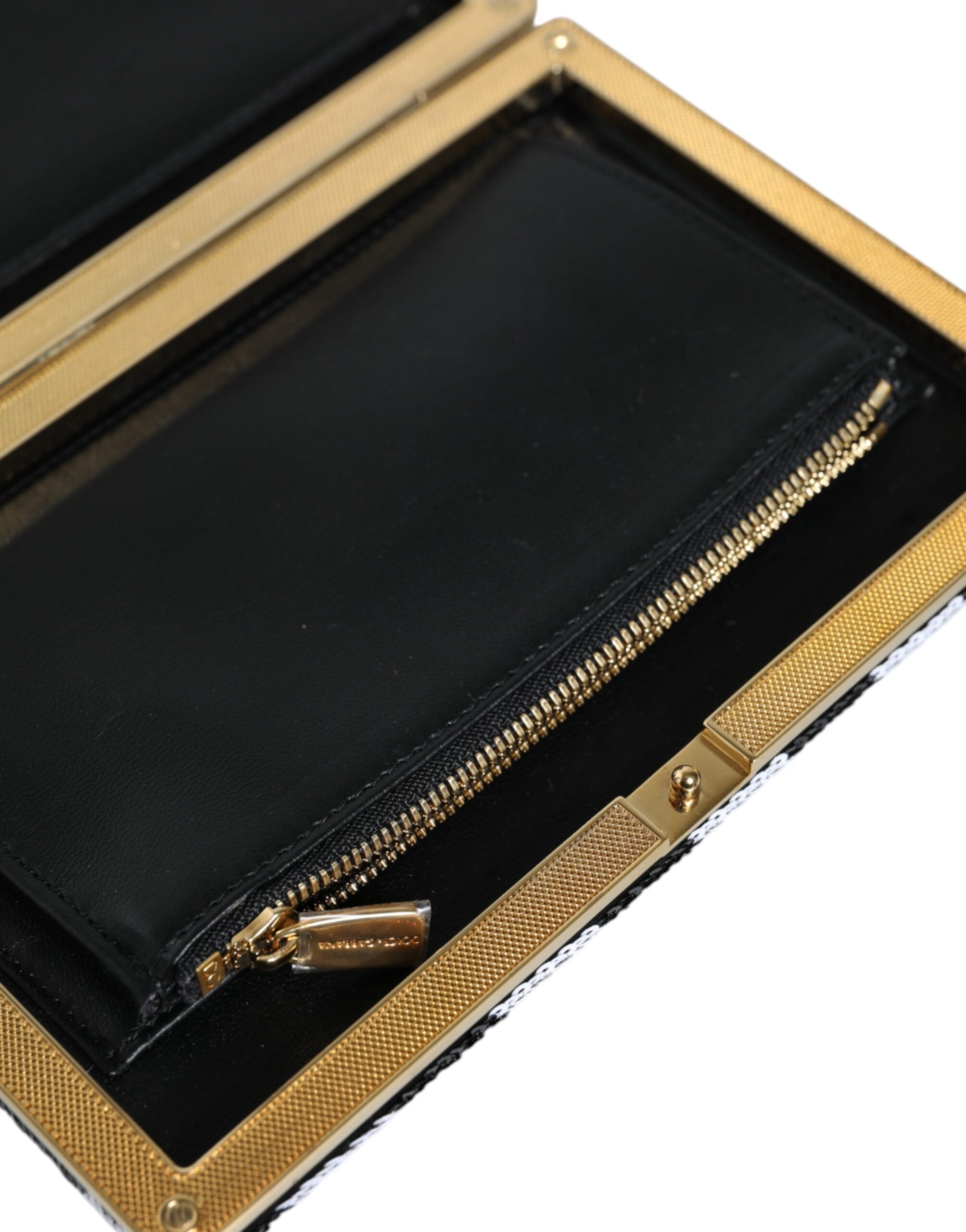 Pochette de soirée Dolce & Gabbana noire et dorée avec cadre blanc